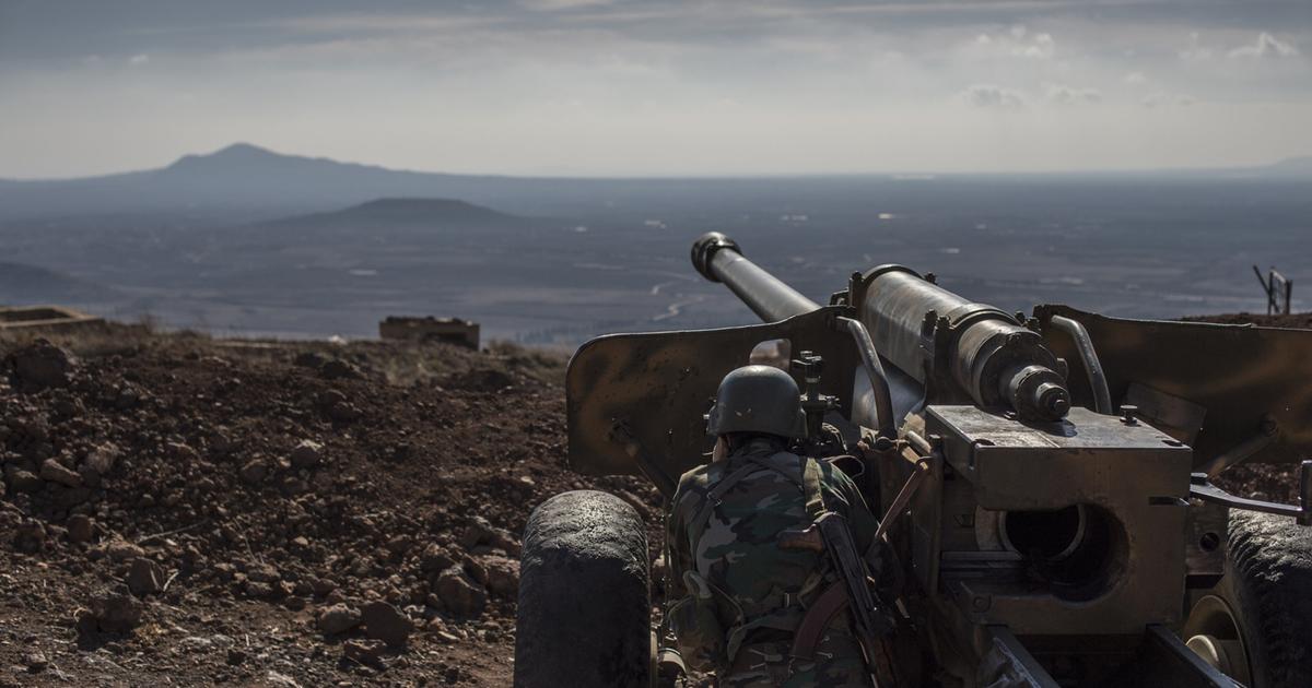 Syrian army Kurdish Soldier mans an artillery piece in Quneitra