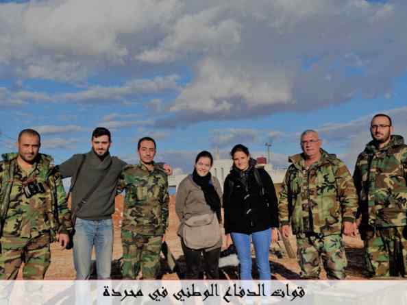 Members of the French far-right Christian NGO SOS Chrétiens d'Orient pose with NDF fighters from Mahradah.