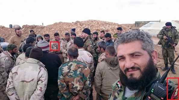 Samir al-Joud, foreground, posing in front of a group of Desert Hawks fighters around Shaer in late 2014. The Desert Hawks patch is just visible on his left shoulder.